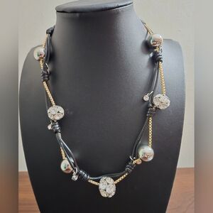 Elegant Black and Gold Necklace with Silver Accents